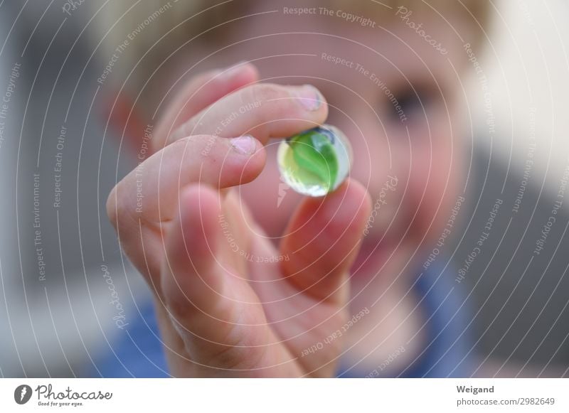 Child with marble in hand Children's game Mother's Day Parenting Kindergarten Human being Toddler 1 To enjoy Sympathy Friendship Together Healthy Marble