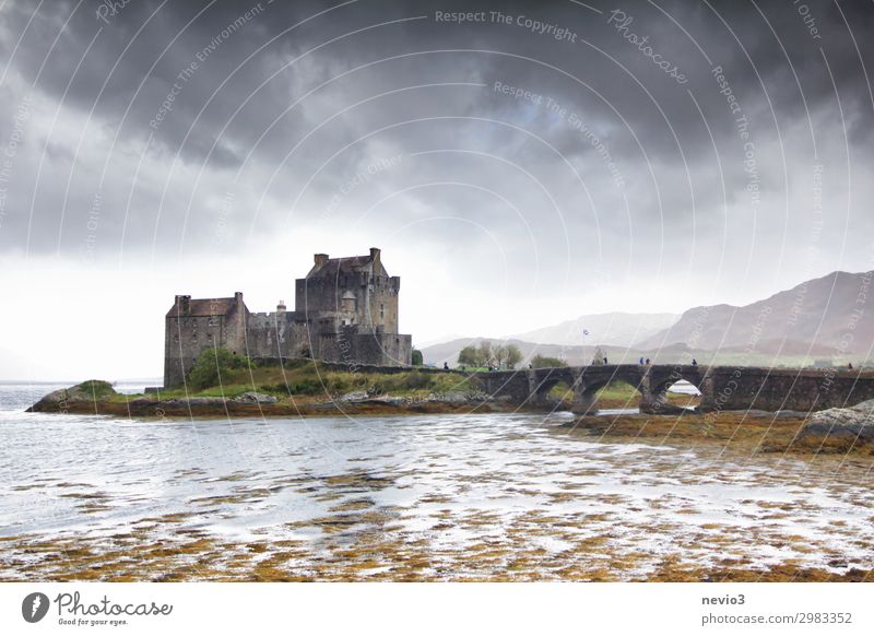 Eilean Donan Castle (Scotland) Landscape Clouds Storm clouds Autumn Bad weather Manmade structures Tourist Attraction Threat Famousness Gray Eilean Donan castle