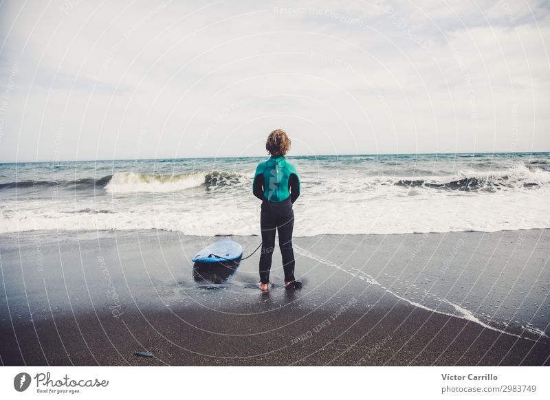 Active Young boy in a surfing day in the summer time Lifestyle Aquatics Child Boy (child) 1 Human being 0 - 12 months Baby Observe To enjoy Authentic Happiness