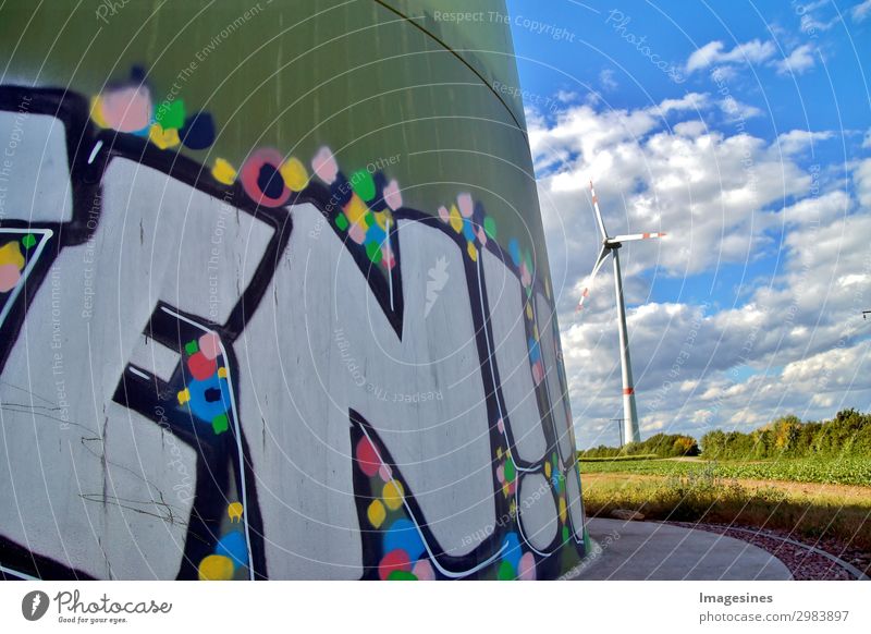 Wind turbine, wind generator with graffiti painting. Technology Energy industry Renewable energy Industry Environment Nature Landscape Sky Clouds Graffiti