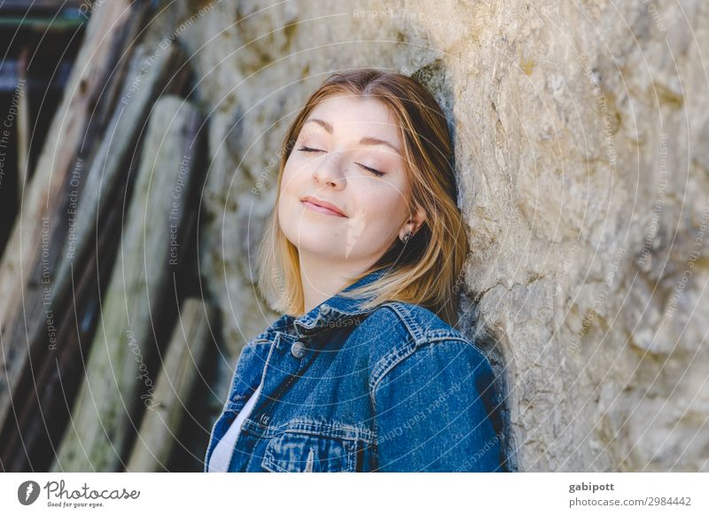 Young woman leaning against a wall with her eyes closed Harmonious Well-being Contentment Senses Relaxation Calm Human being Feminine Youth (Young adults) Woman