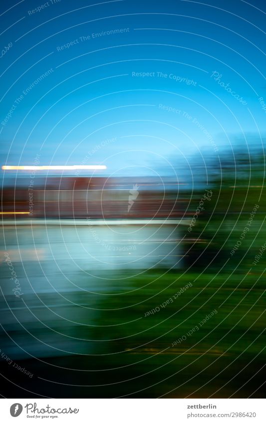 Blurred Evening Dusk Motion blur Block Twilight Dark Closing time House (Residential Structure) Sky Heaven Tracer path Moon Poetic Shallow depth of field