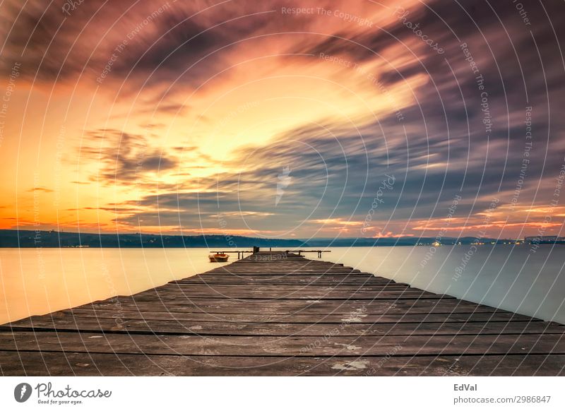 Exciting sky with clouds at the shore with wooden pier and boat dusk amazing background beautiful beauty bridge bright calm cloudscape colorful dramatic evening