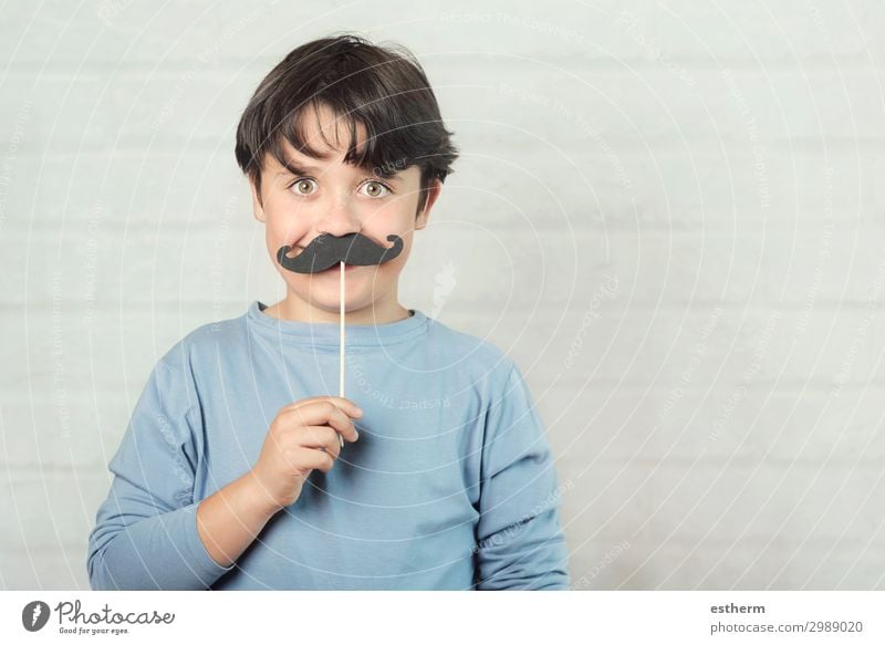 Happy father´s day,boy with false mustache on stick on brick background Lifestyle Joy Feasts & Celebrations Human being Masculine Man Adults Father