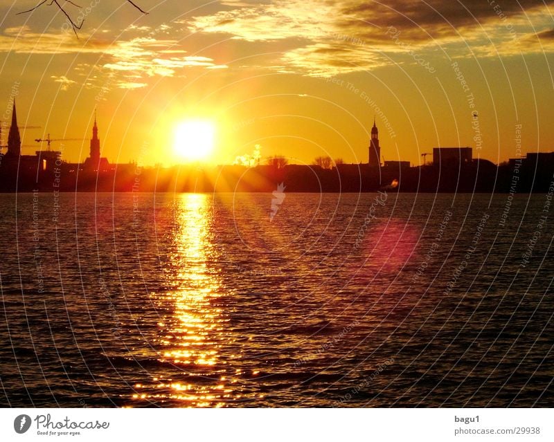 Sun over Hamburg Town Alster St. Michael's Church Sunset Back-light Clouds Europe Water Silhouette