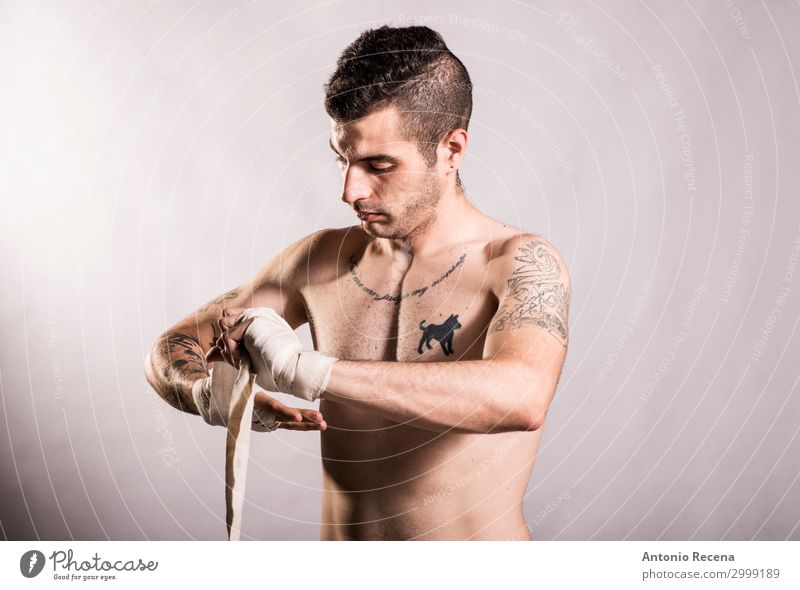 Muai thai fighter posing in studio shot with tattoos Sports Boy (child) Man Adults Ring Tattoo Gloves Fitness Aggression Strong Anger Power Protection Force