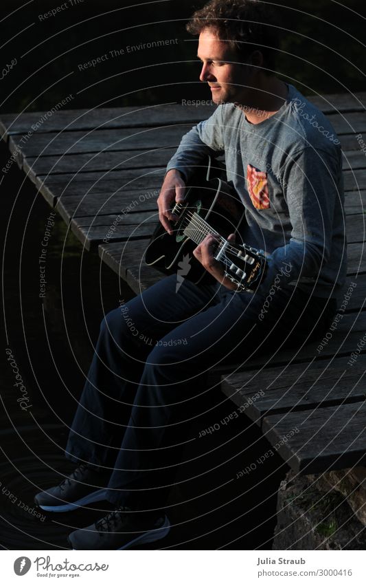 Man Lake Bridge Guitar Sweater Brunette Short-haired Curl Sit Playing Dark Guitarist Footbridge Eyes Closed Music Musician Musical instrument Relaxation Break