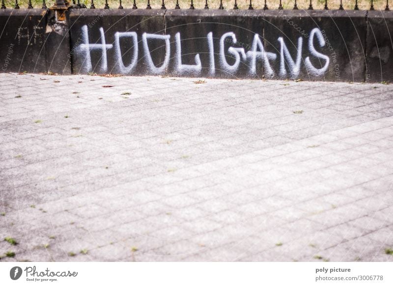 "HOOLIGANS" Graffiti on a grey wall Town Downtown Deserted Sign Aggression Education Protection Feeble Safety Hooligan Illustration Capital letter Logo