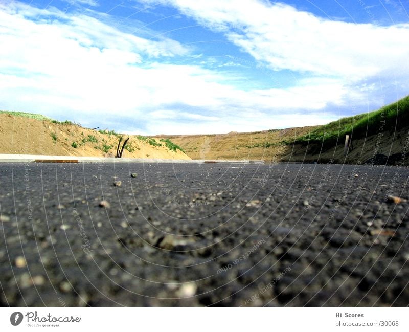 A17 Access road 2 Highway Tar Clouds Hill Worm's-eye view Asphalt Pavement Pile up Traffic lane Transport Street Stone Sky Perspective height