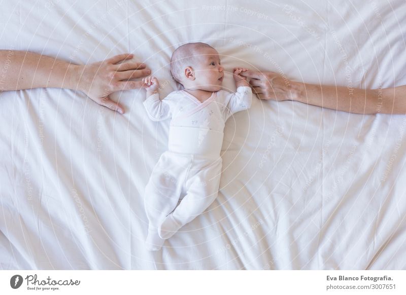 portrait of beautiful baby on white background at home Beautiful Skin Face Relaxation Child Human being Baby Boy (child) Mother Adults Father Family & Relations