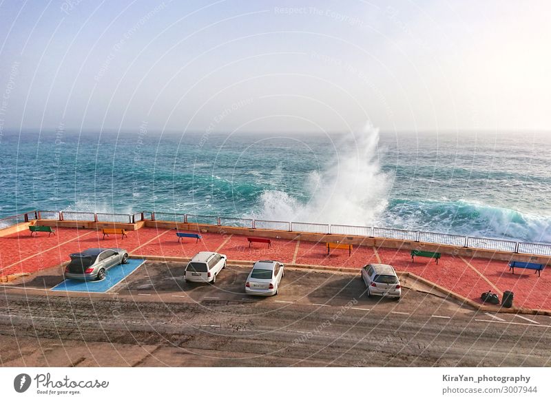 Car parking along coastline with large waves Vacation & Travel Tourism Summer Ocean Island Waves Nature Landscape Sky Weather Storm Wind Coast Street Blue