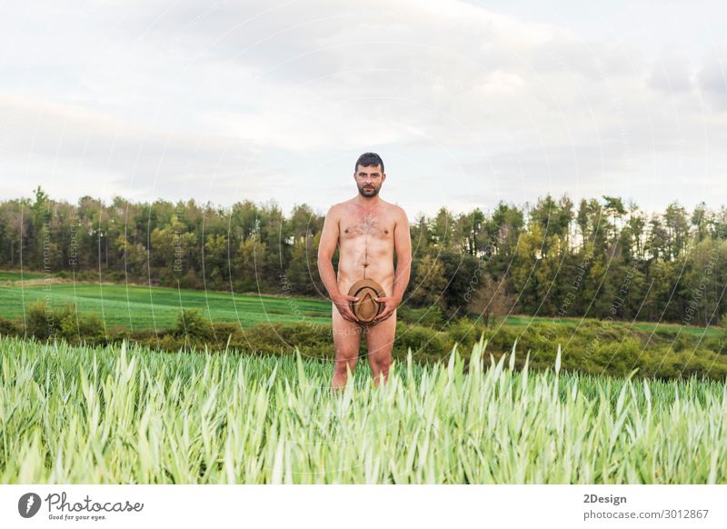 Man covering himself with summer hat at countryside. Lifestyle Body Skin Relaxation Vacation & Travel Summer Sunbathing Beach Ocean Human being Masculine