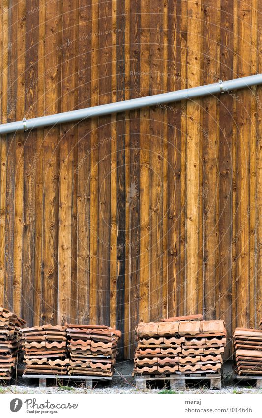 Well stored Hut Wall (barrier) Wall (building) Eaves Wooden wall Simple Brown Orderliness Uniqueness Palett Roofing tile Stored Downspout Diagonal Tilt Stack