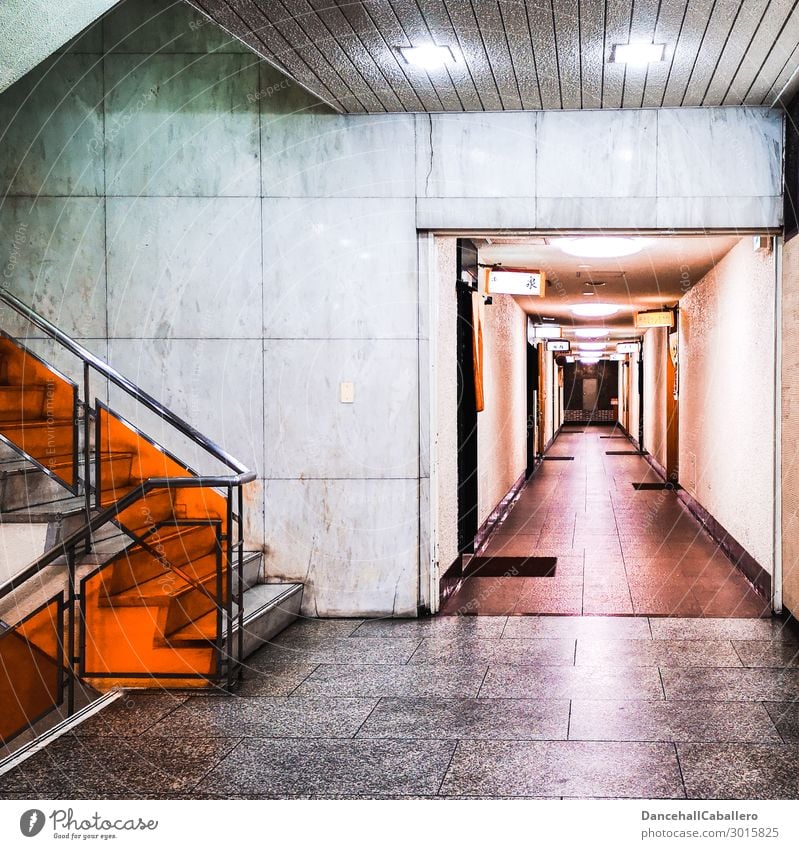 stairwell Town Wall (barrier) Wall (building) Stairs Door Doormat Dark Gray Orange Staircase (Hallway) Banister Tile Entrance Way out Upward Downward