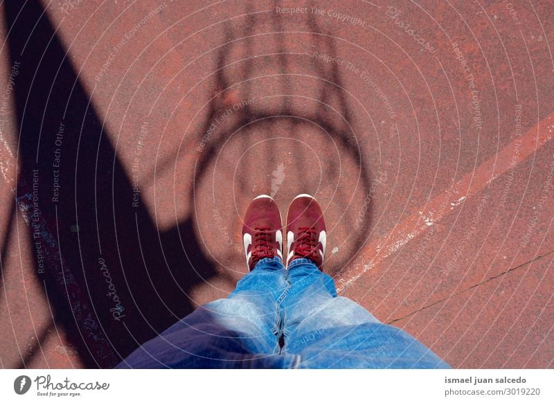 feet and basket shadow silhouette on the ground in the street Feet body part Human being Legs Sneakers Footwear Ground Street Sports Lifestyle Stand Colour