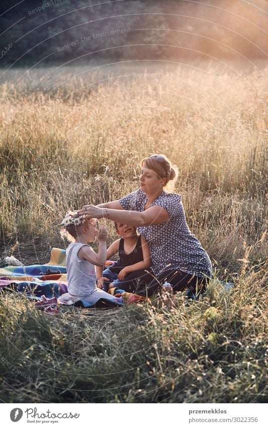 Family spending time together on a meadow Lifestyle Joy Happy Relaxation Leisure and hobbies Playing Vacation & Travel Summer Summer vacation Child Human being