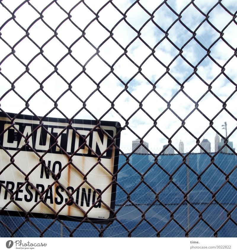 premonition Fence Wire netting fence Sky Clouds Skyline High-rise Characters Signs and labeling Signage Warning sign Blue Self-confident Protection Watchfulness