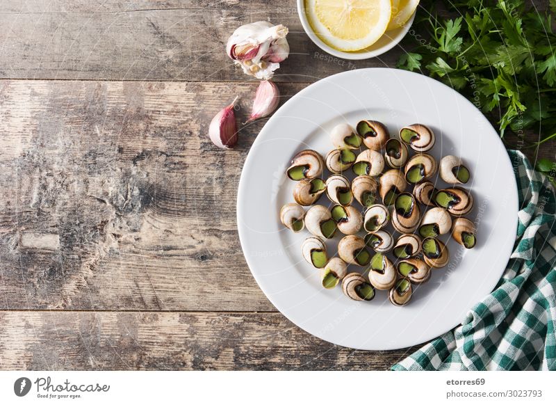 Escargots de Bourgogne on wooden table. Burgundy Cooking Diet Dinner eat escargots escargots de bourgogne Food Healthy Eating Food photograph French Fresh