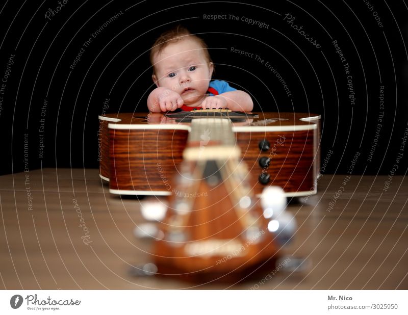 Rock 'n' Roll Junior Leisure and hobbies Music Human being Baby 1 0 - 12 months Listen to music Musician Guitar Listening Guitarist Guitar neck Guitar string