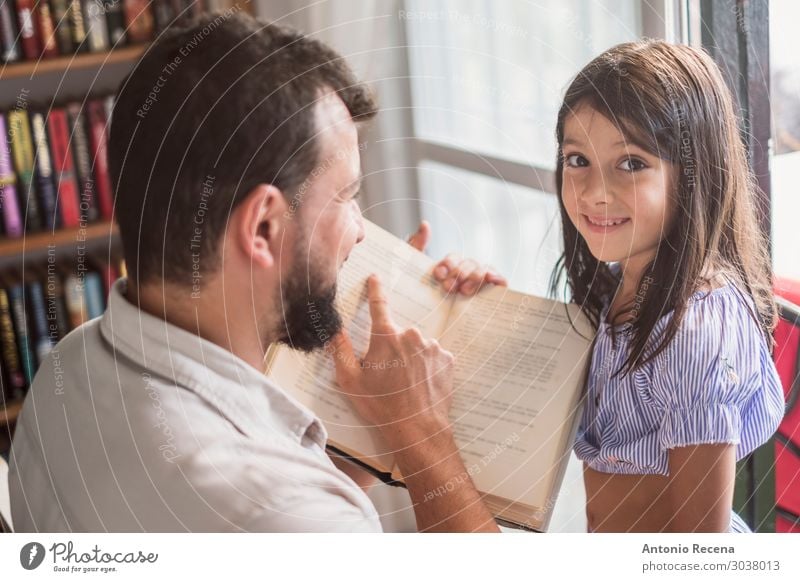 father and daughter reading book Reading House (Residential Structure) Child Human being Woman Adults Man Parents Father Family & Relations Culture Book Sit