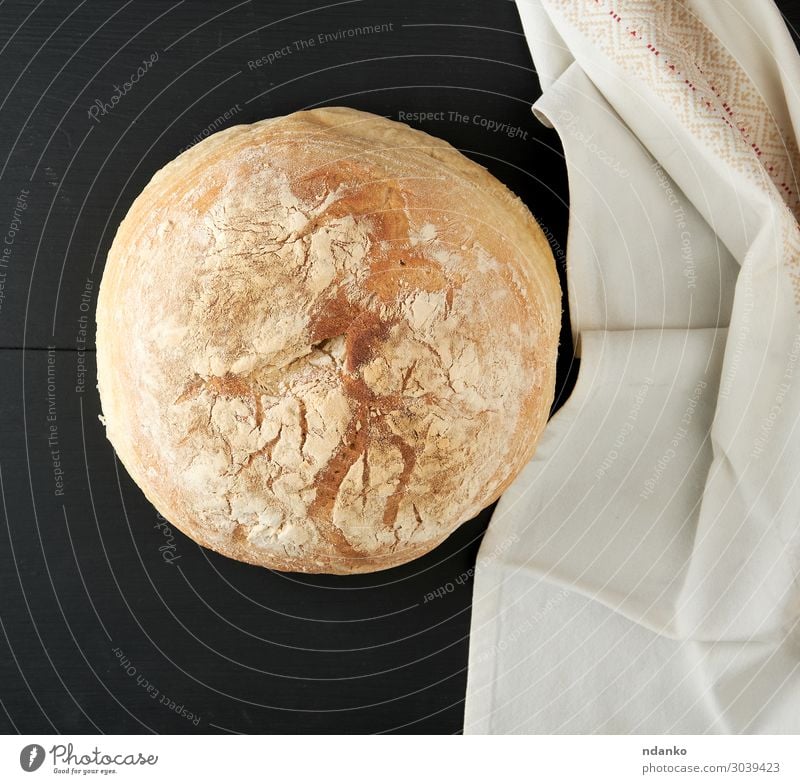 baked round white wheat bread on a textile towel Bread Roll Nutrition Eating Breakfast Dinner Table Kitchen Wood Old Dark Fresh Natural Brown Yellow Black White