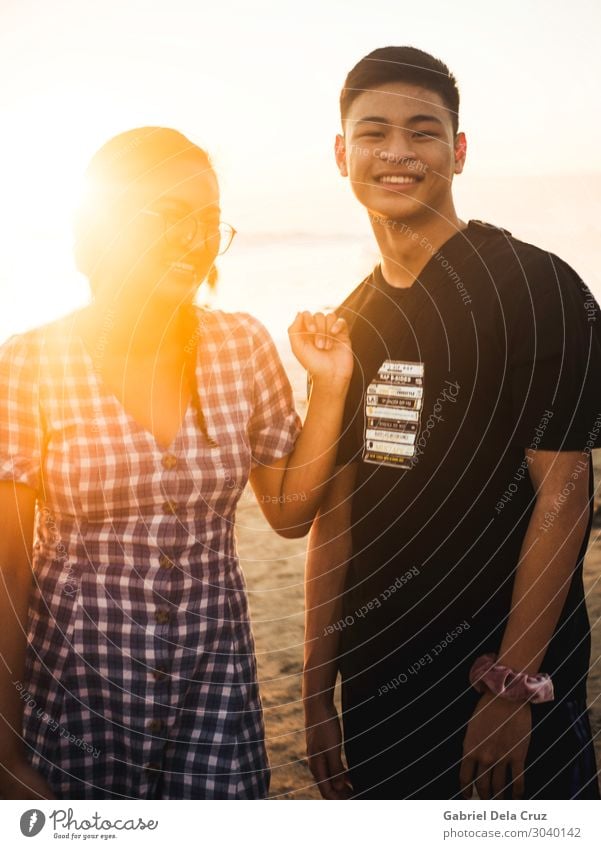 Siblings in the sunset Vacation & Travel Tourism Trip Adventure Sun Sunbathing Beach Masculine Feminine Young woman Youth (Young adults) Young man