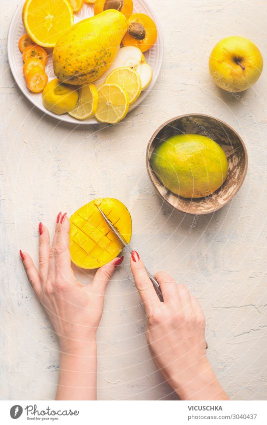 Mango preparation. Hands cut mango half in lattice pattern Food Fruit Crockery Knives Style Design Healthy Eating Cooking Kitchen Table Food photograph