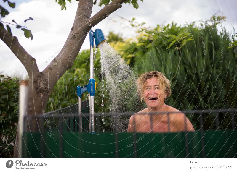 showers in the garden Garden Human being Feminine Woman Adults Life 1 45 - 60 years Nature Tree Laughter Stand Illuminate Simple Curiosity Joy Happy Happiness