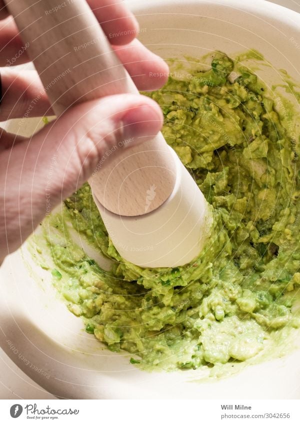 Making Guacamole Avocado Food Healthy Eating Dish Food photograph guacamole Mexicans Mortar Smash Stir Make Green Tool Cooking Kitchen Dinner