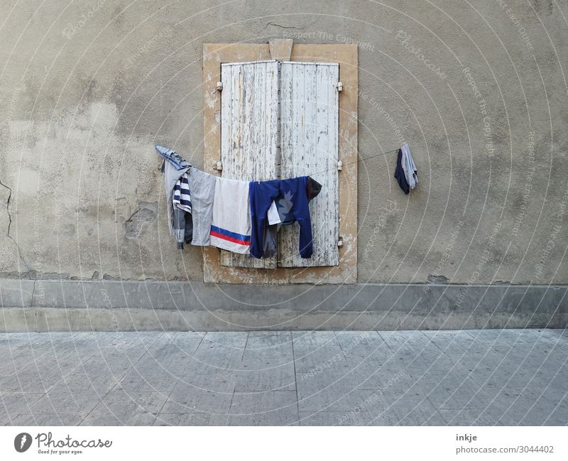 clothesline, out of place Deserted Facade Window Street Sidewalk Shutter Clothesline Laundry Hang Authentic Simple Brown Gray Poverty Living or residing Dry