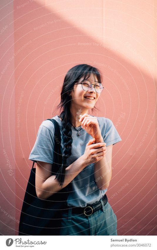 A young lady laughing, looking towards the right of the camera Feminine Young woman Youth (Young adults) Sister 1 Human being 18 - 30 years Adults Smiling