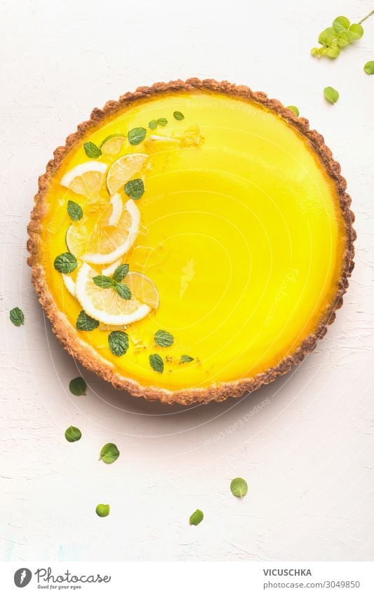 Lemon tart with lemon slices and lemon peel Food Fruit Cake Dessert Nutrition Style Design Summer Yellow citrus Background picture top view lemon tart