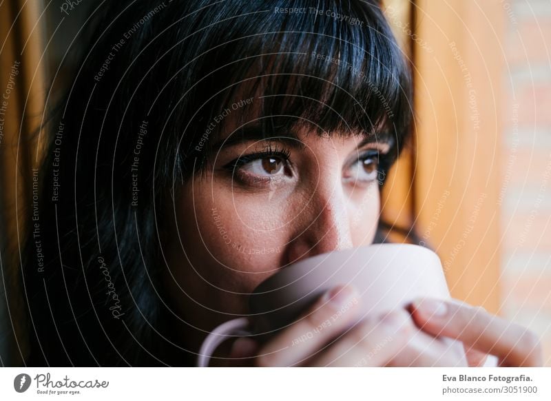 young woman at home by the window having a coffee Drinking Coffee Tea Lifestyle Beautiful Relaxation Leisure and hobbies Reading Vacation & Travel