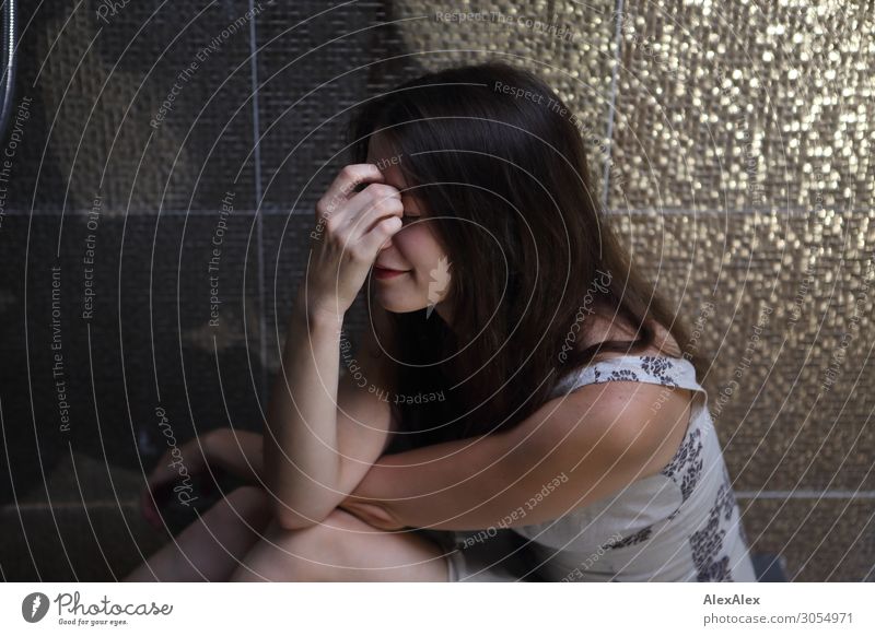 Young woman sitting on the ground holding her hand in front of her face Lifestyle Beautiful Calm Flat (apartment) Bathroom Shower (Installation) Tile