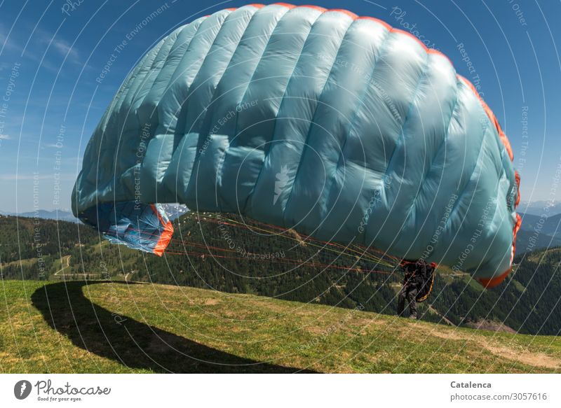 Take off, a blue paraglider takes off Sports Paragliding Legs 1 Human being Nature Landscape Sky Horizon Summer Beautiful weather Grass Meadow Mountain