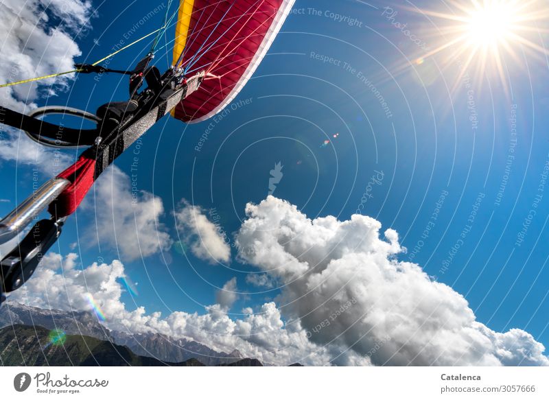 Taken off | Paragliding Landscape Elements Sky Clouds Sun Summer Beautiful weather Mountain Belt carbine Paraglider Flying To enjoy Hang Blue Yellow Gray Orange