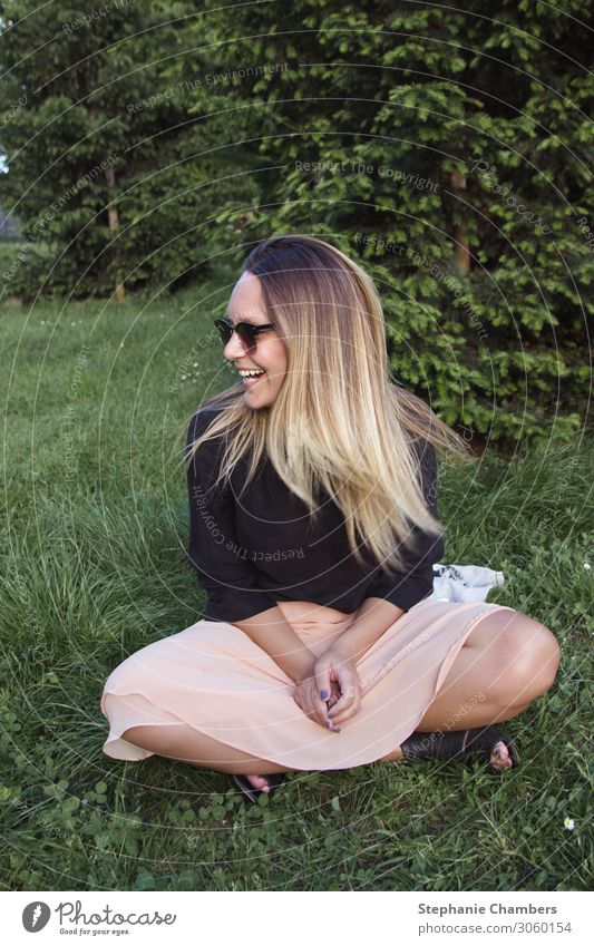 Woman with sunglasses smiling. Joy Beautiful Feminine Adults 1 Human being Smiling Laughter Happiness Colour photo Exterior shot Looking away