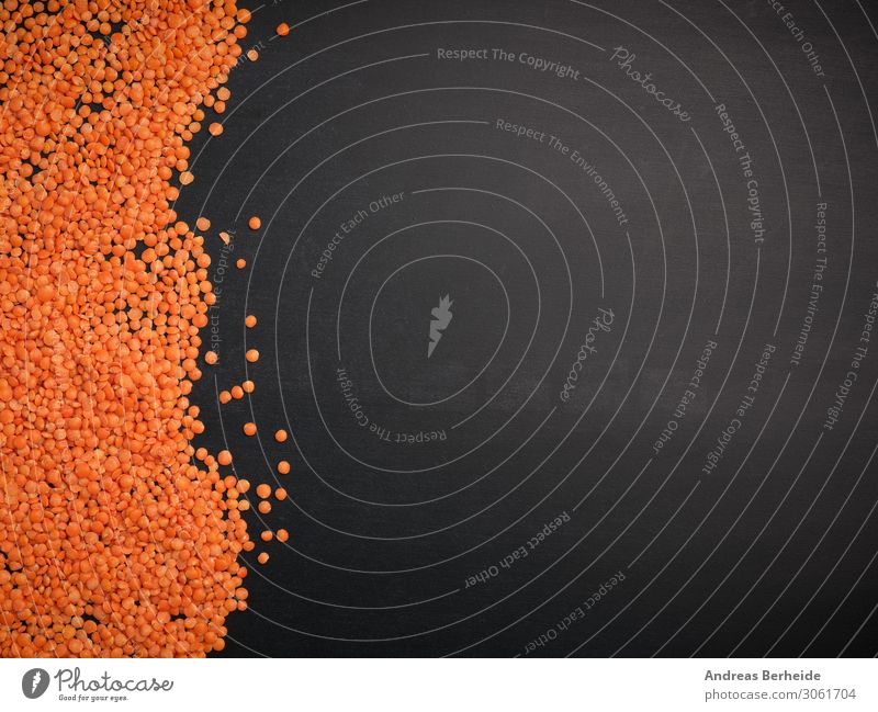 Red lentils on a blackboard Organic produce Vegetarian diet Healthy Eating Delicious chalkboard Gourmet recipe detox traditional seed natural brown texture