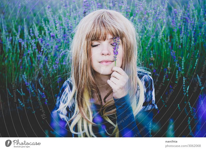 Young woman enjoying the day in a field of lavender Herbs and spices Lifestyle Beautiful Face Cosmetics Alternative medicine Medication Relaxation Human being