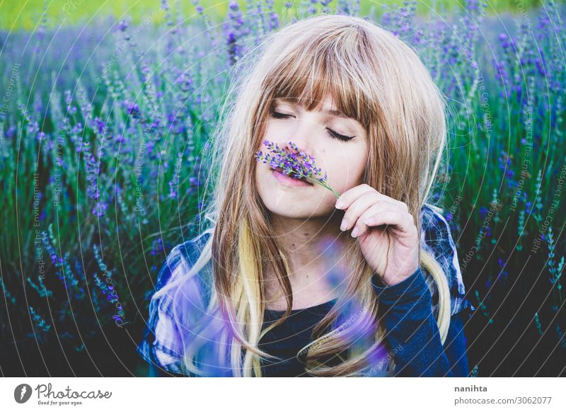 Young woman enjoying the day in a field of lavender Herbs and spices Lifestyle Beautiful Face Cosmetics Alternative medicine Medication Relaxation Human being