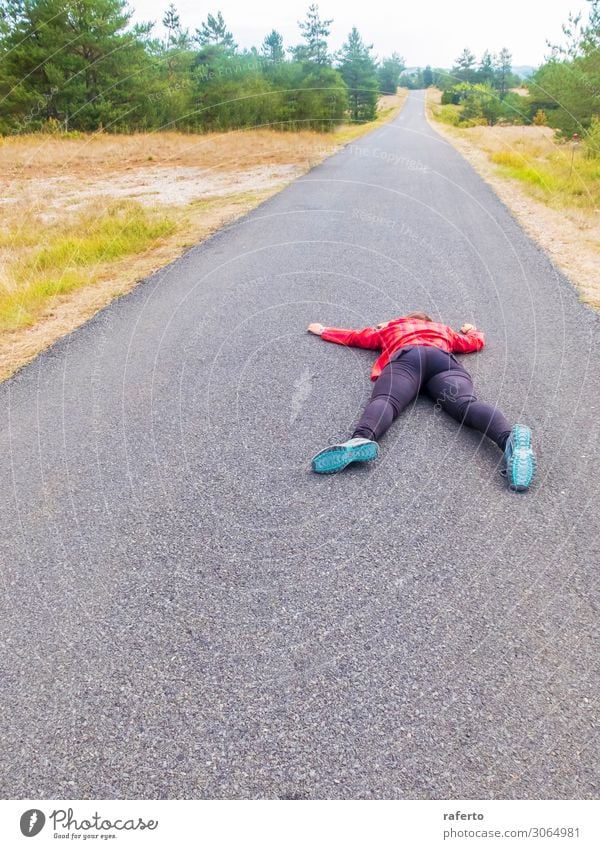 Woman lying down on a road after accident Body Human being Adults Town Transport Street Lie Collision Expression Road safety Ambulance terrify Wound shocked