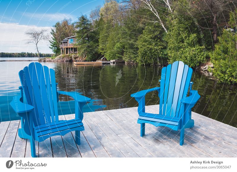 Muskoka chairs Joy Calm Vacation & Travel Summer Summer vacation Sun Sunbathing Chair Swimming & Bathing Nature Sky Lake Lakeside Blue Happiness Contentment