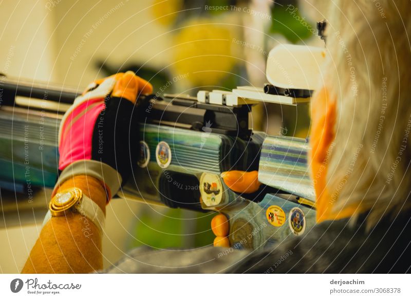 Women's quota for air rifle shooting. A woman can be seen from the side as she fires her rifle. Joy Leisure and hobbies Shoot Sports Rifle Hall Feminine Head