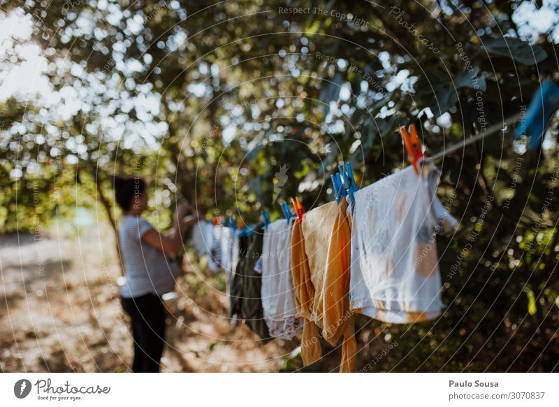 Pregnant woman hanging clothes on line Lifestyle Living or residing House (Residential Structure) Human being Feminine 1 Work and employment Hang Cleaning