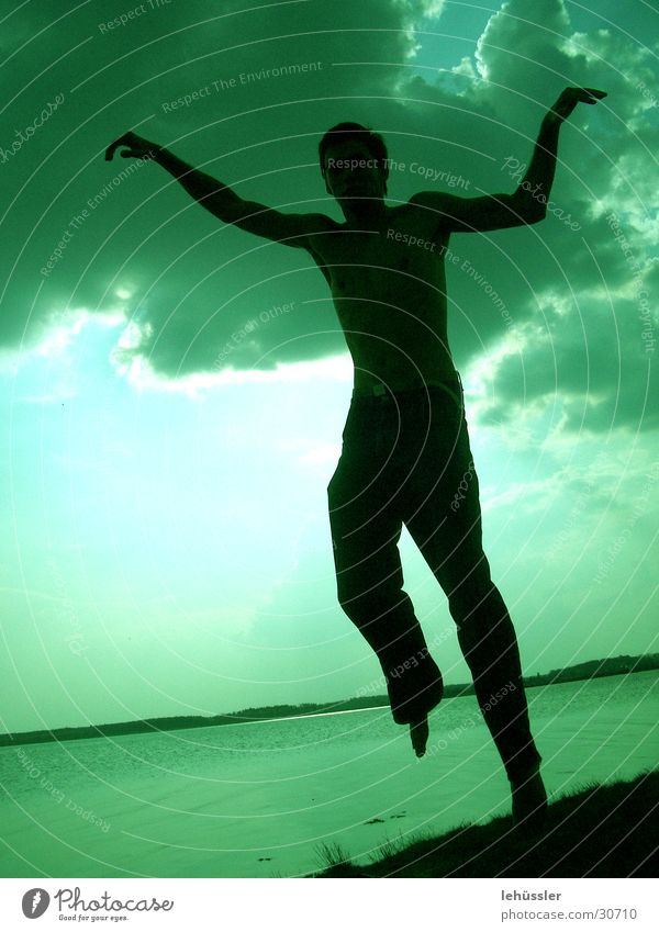 human crane Man Masculine Crane Jump Karate Green Lake Ocean Clouds Light Human being Shadow