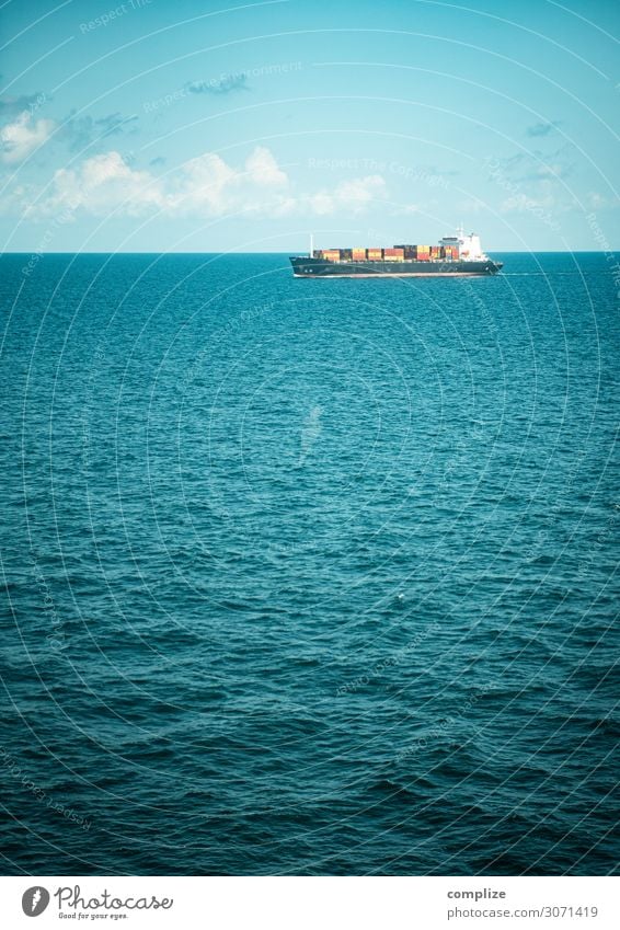 A container ship at sea Economy Trade Logistics Nature Sky Clouds Sun Climate change Beautiful weather Waves Coast North Sea Baltic Sea Ocean Transport