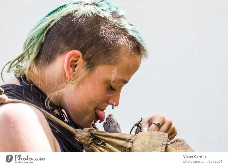 A young punk girl kissing a rat in the street Lifestyle Exotic Human being Feminine Androgynous Young woman Youth (Young adults) 1 18 - 30 years Adults Rat