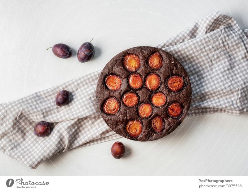 Plum cake with chocolate. Pretty food Fruit Dessert Candy Chocolate Lunch Bowl Autumn Happy Brown Appetite Tradition above view autumn food Baking Bakery