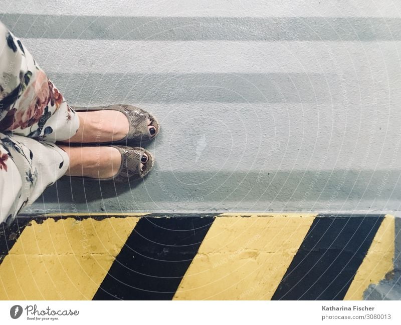 Shoe perspective II Pants Footwear Concrete Signs and labeling Signage Warning sign Road sign Graffiti Stand Yellow Gray Pink Red Black White Symmetry Stripe