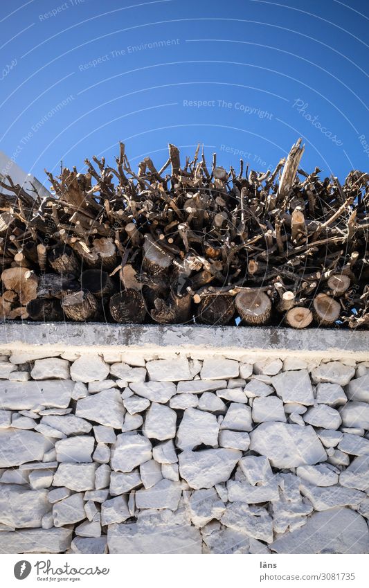 firewood Sky Cloudless sky Island Naxos Stone Wood Blue Brown White Effort Resolve Emphasis Firewood Stack Bricklayer Colour photo Exterior shot Deserted